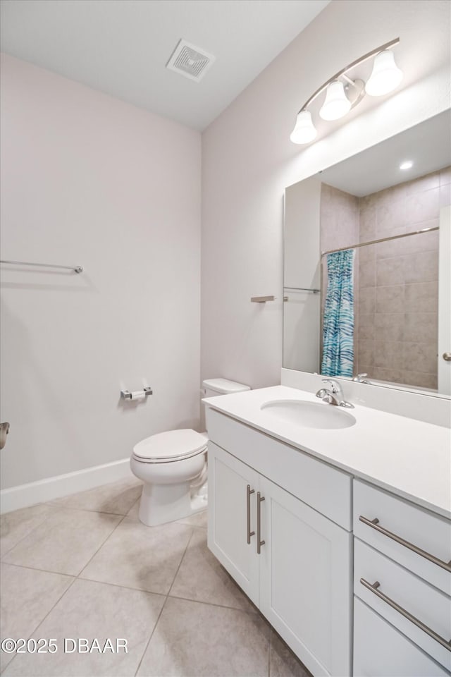 bathroom featuring vanity, a shower with curtain, visible vents, tile patterned flooring, and toilet