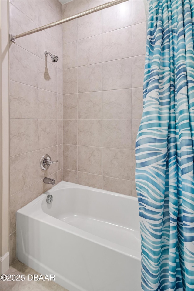 bathroom with shower / bath combination with curtain