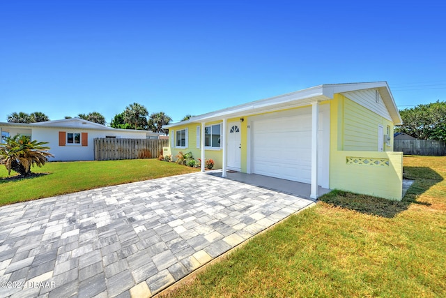 ranch-style home with a garage and a front yard