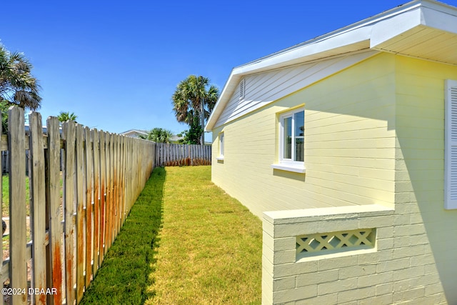 view of property exterior with a yard