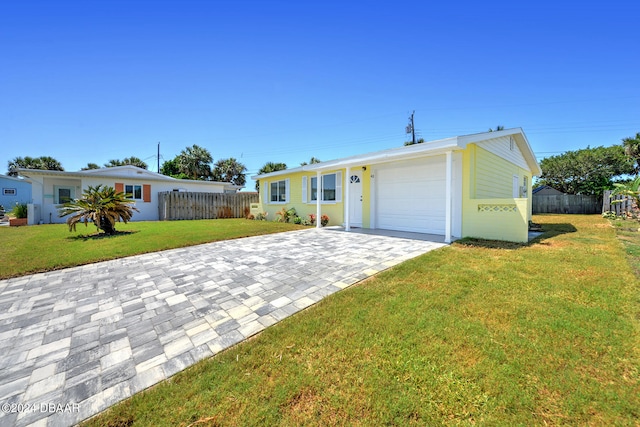 single story home with a garage and a front yard