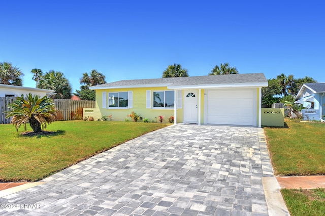 view of front of home with a garage and a front yard