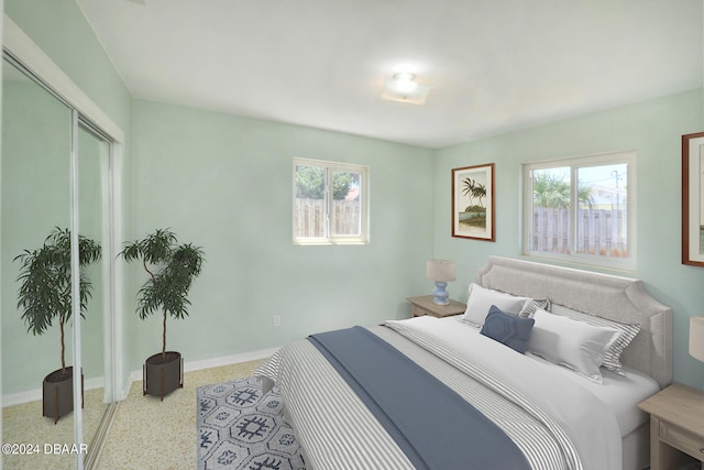 bedroom featuring a closet and multiple windows