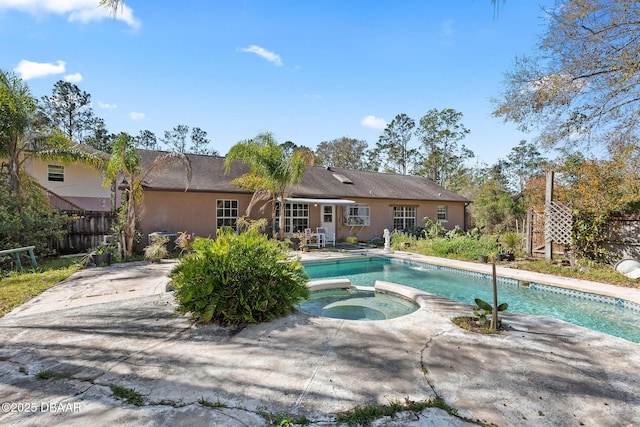 3531 Red Barn Ln, Ormond Beach, FL 32174 - view of swimming pool featuring a pool with connected hot tub and a patio area