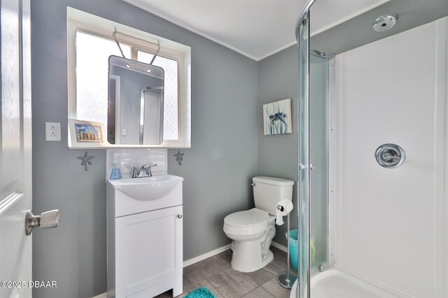 7 Azalea Dr, Ormond Beach, FL 32176 - bathroom featuring baseboards, toilet, a stall shower, and vanity