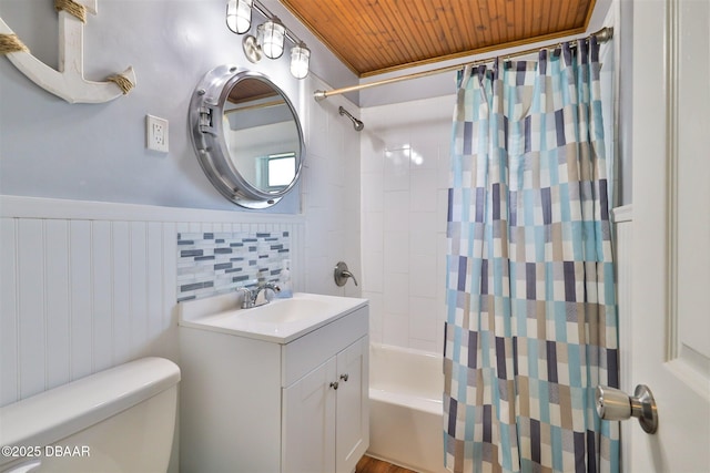 7 Azalea Dr, Ormond Beach, FL 32176 - full bathroom featuring toilet, wooden ceiling, vanity, wainscoting, and shower / bath combo with shower curtain
