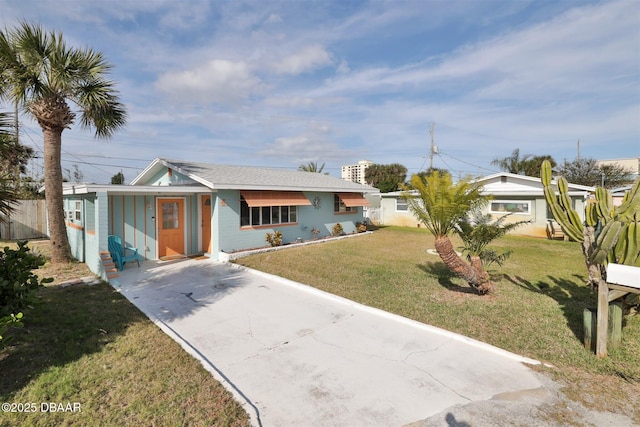 7 Azalea Dr, Ormond Beach, FL 32176 - view of front facade with a front lawn and concrete driveway