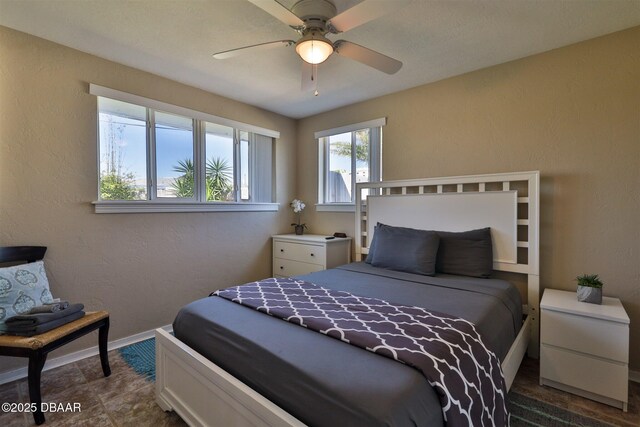 7 Azalea Dr, Ormond Beach, FL 32176 - bedroom featuring a textured wall, baseboards, and ceiling fan