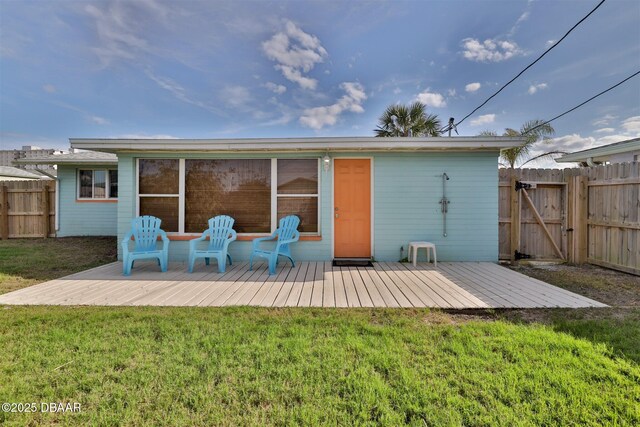 7 Azalea Dr, Ormond Beach, FL 32176 - back of house with a yard, a gate, a deck, and fence