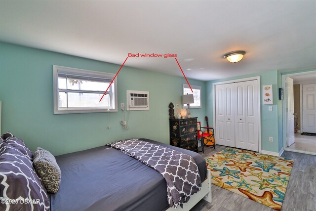 7 Azalea Dr, Ormond Beach, FL 32176 - bedroom featuring baseboards, a closet, a wall unit AC, and wood finished floors