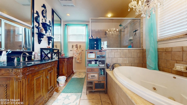 bathroom with tile patterned floors, plus walk in shower, vanity, and a notable chandelier