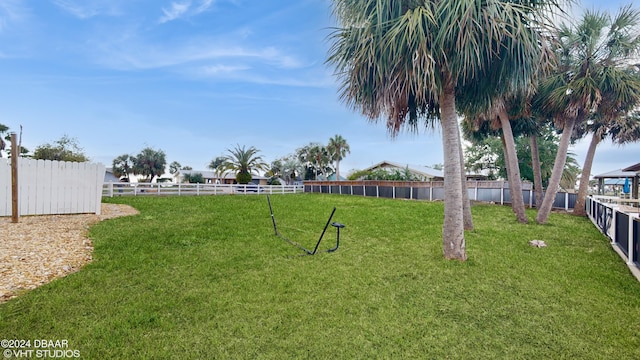 back of property featuring a lawn and a balcony