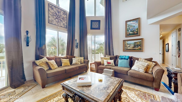 tiled living room with a high ceiling