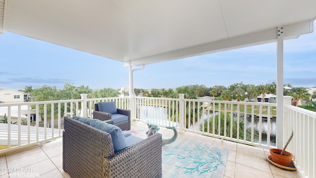 balcony featuring a water view