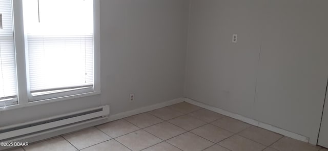 312 Frances Ter, Daytona Beach, FL 32118 - unfurnished room featuring a baseboard radiator and light tile patterned floors