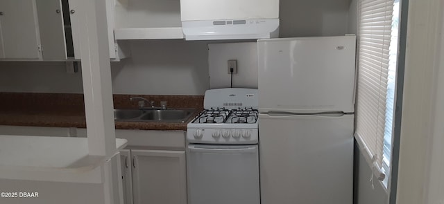 312 Frances Ter, Daytona Beach, FL 32118 - kitchen featuring white appliances, water heater, and white cabinetry