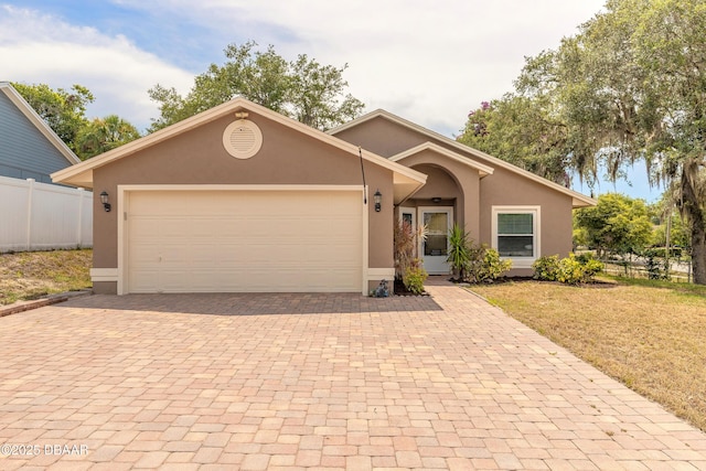 198 Heather Lane Dr, Deltona, FL 32738 - view of front of home with decorative driveway, stucco siding, and an attached garage