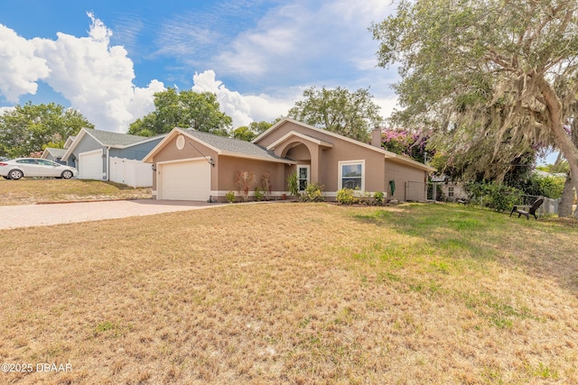 198 Heather Lane Dr, Deltona, FL 32738 - single story home with concrete driveway, an attached garage, stucco siding, and a chimney