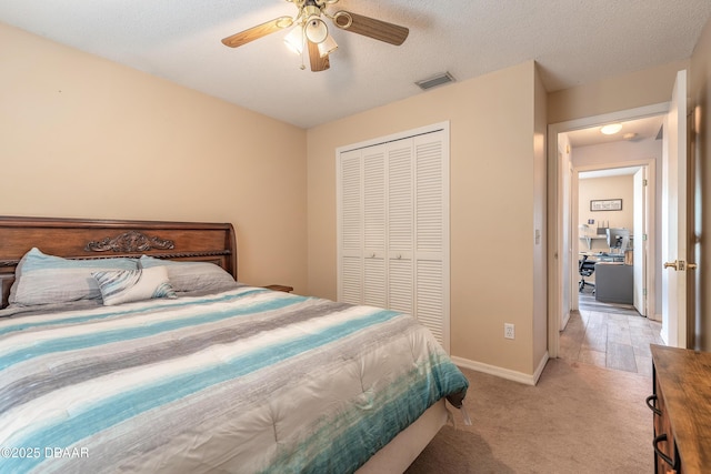 198 Heather Lane Dr, Deltona, FL 32738 - bedroom featuring a closet, light carpet, a ceiling fan, and a textured ceiling