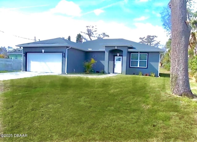 single story home with driveway, stucco siding, an attached garage, and a front yard