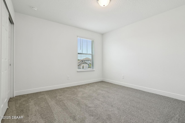 288 Links Terrace Blvd, Daytona Beach, FL 32124 - unfurnished bedroom featuring a closet and carpet floors