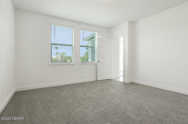 288 Links Terrace Blvd, Daytona Beach, FL 32124 - carpeted empty room with baseboards
