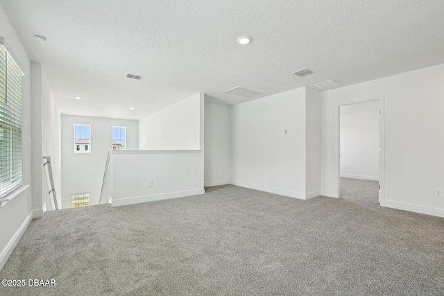 288 Links Terrace Blvd, Daytona Beach, FL 32124 - spare room featuring a textured ceiling, carpet flooring, and recessed lighting