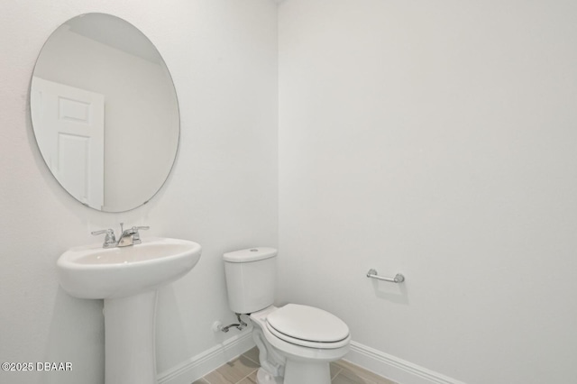 288 Links Terrace Blvd, Daytona Beach, FL 32124 - half bath featuring toilet and baseboards