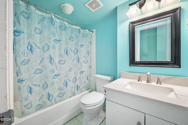 full bathroom featuring toilet, vanity, tile patterned flooring, and shower / bath combo with shower curtain