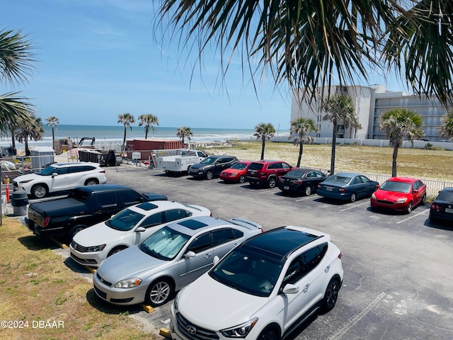 view of parking featuring a water view