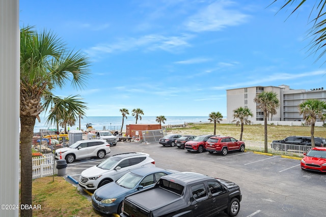 view of parking / parking lot featuring a water view