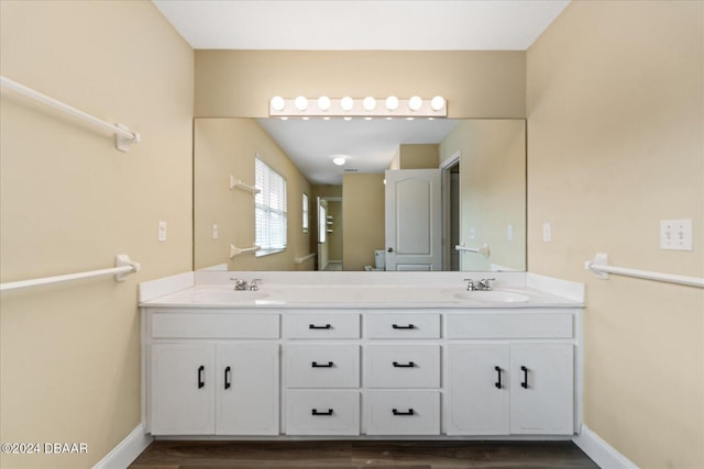 bathroom featuring vanity and hardwood / wood-style flooring