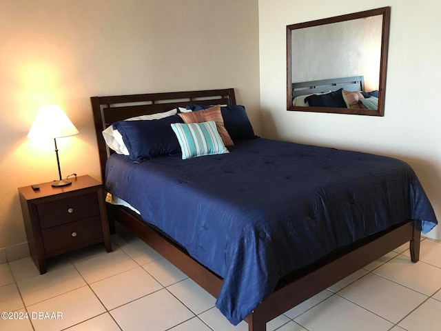 bedroom with light tile patterned flooring