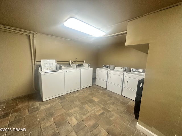 laundry area with washing machine and clothes dryer