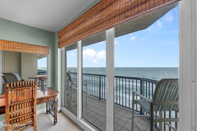 sunroom / solarium with a water view