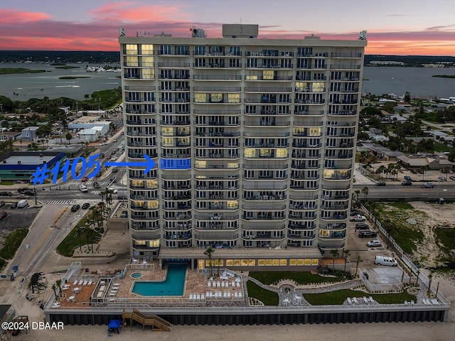 outdoor building at dusk featuring a water view