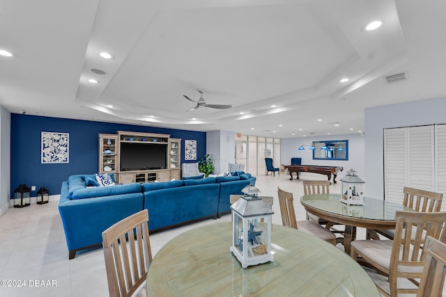 dining area featuring ceiling fan, pool table, and a tray ceiling