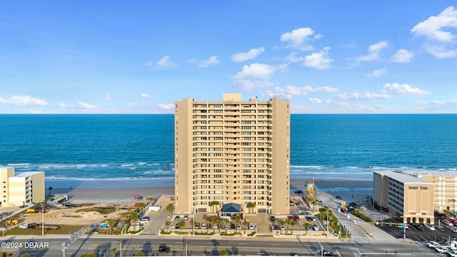 bird's eye view with a water view and a view of the beach