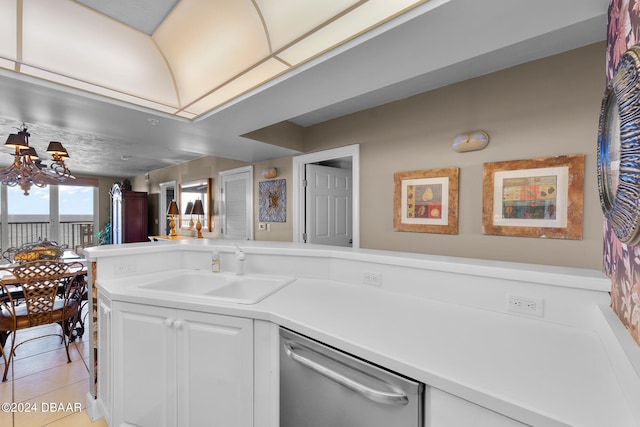 kitchen with sink, light tile patterned floors, stainless steel dishwasher, a chandelier, and white cabinets