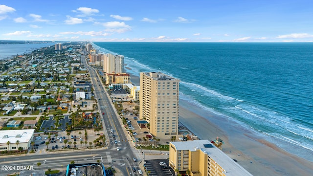 drone / aerial view featuring a view of the beach and a water view