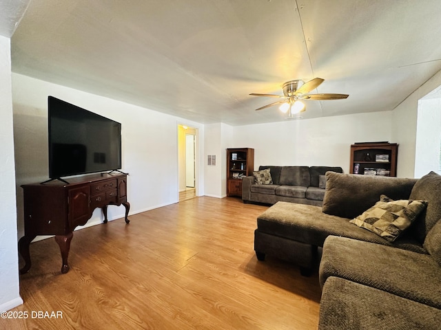 1228 Leon Ln, Daytona Beach, FL 32117 - living area featuring light wood-type flooring, a ceiling fan, and baseboards