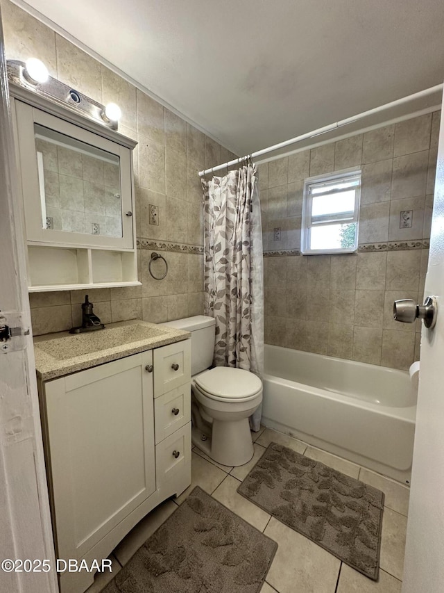 1228 Leon Ln, Daytona Beach, FL 32117 - full bathroom featuring toilet, tile patterned floors, shower / bath combo, vanity, and tile walls