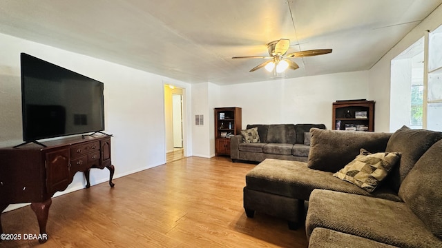 1228 Leon Ln, Daytona Beach, FL 32117 - living room featuring wood finished floors, a ceiling fan, and baseboards
