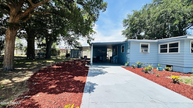 1228 Leon Ln, Daytona Beach, FL 32117 - view of front of property with driveway and an attached carport