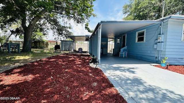 1228 Leon Ln, Daytona Beach, FL 32117 - view of front of home featuring concrete driveway and a carport