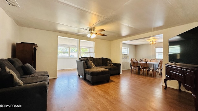 1228 Leon Ln, Daytona Beach, FL 32117 - living room with wood finished floors, a ceiling fan, and baseboards