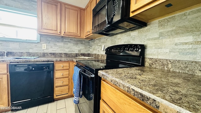 1228 Leon Ln, Daytona Beach, FL 32117 - kitchen with black appliances and backsplash