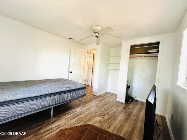 1228 Leon Ln, Daytona Beach, FL 32117 - bedroom with wood finished floors, a closet, baseboards, and ceiling fan