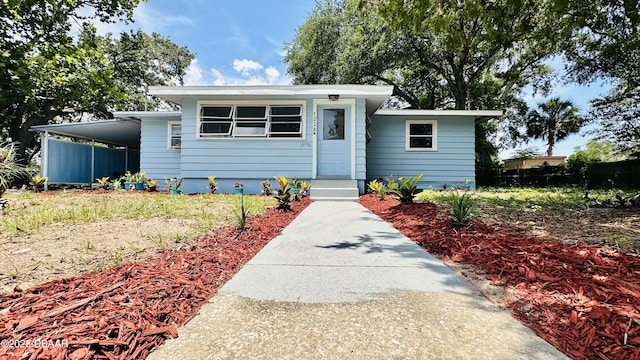1228 Leon Ln, Daytona Beach, FL 32117 - bungalow-style home with a carport