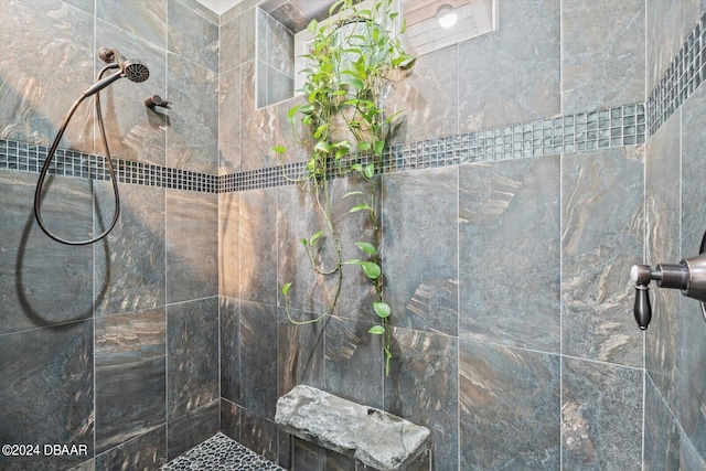 bathroom with a tile shower